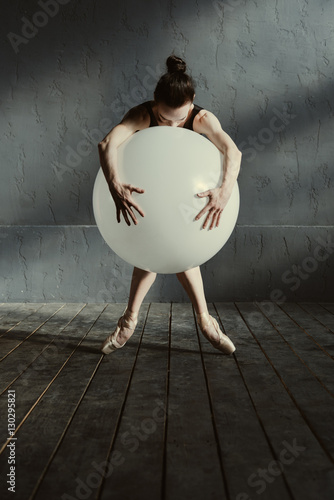 Static ballet dancer performing using the white balloon