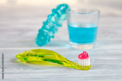 children s toothbrush oral care on wooden background