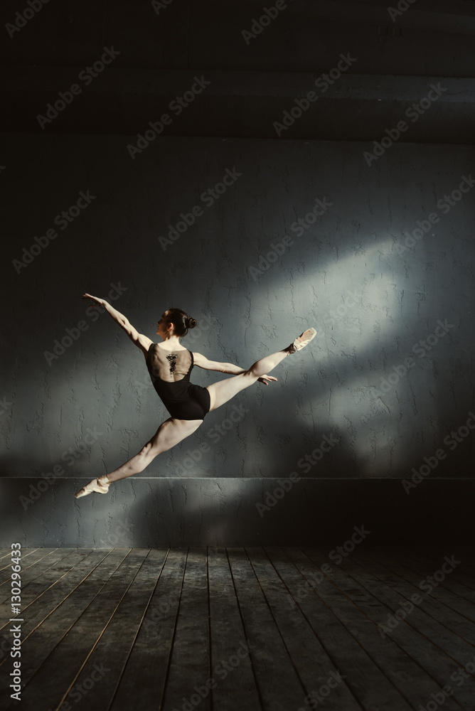 Airy ballet dancer stretching before the performance Airy ballet dancer stretching before the performance