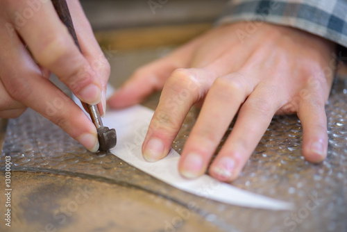 tradesman doing stencilling