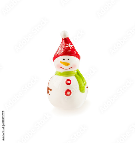 Porcelain figurine Snowman on white. Christmas and New Year theme.