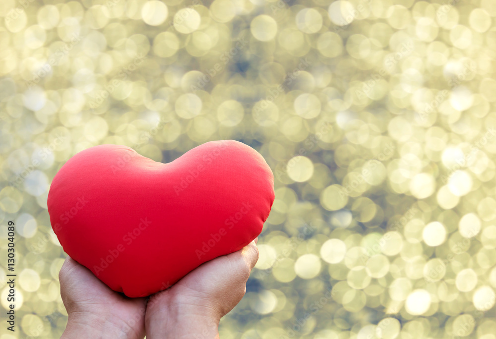 Big red heart in hand, love concept and valentine Big red heart in hand, love concept and valentine