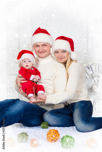 Happiness family in christmas hat on white background.