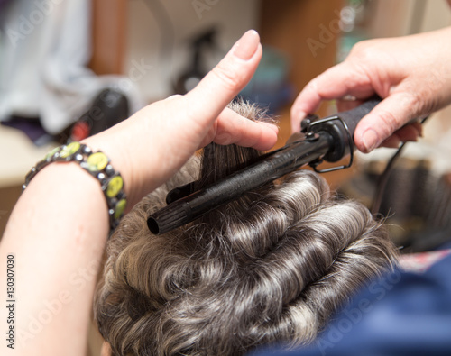 wrap hair curling in a beauty salon