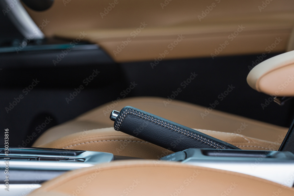 Detail of modern car interior, Focus on hand break Detail of modern car interior, Focus on hand break