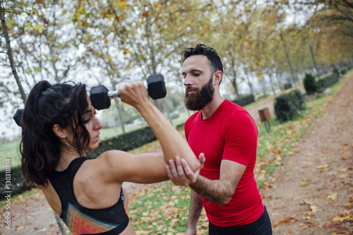 Personal trainer in the autumn park