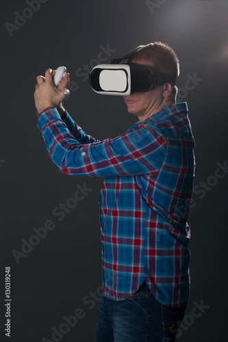 Man wearing virtual reality glasses,studio shot