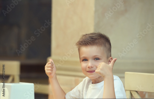 Cute boy in restaurant