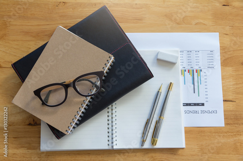 Analysis chart and paperwork on office table