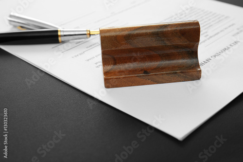 Stamp, document and pen on ...