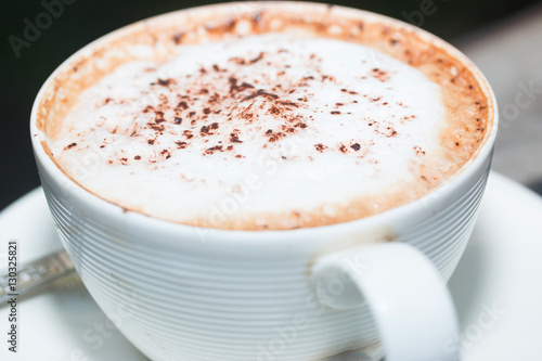 hot coffe on coffee cup on wood table 