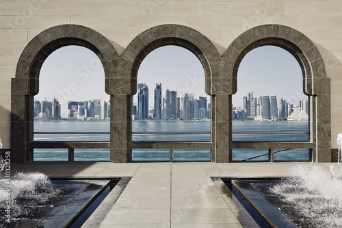 Downtown Doha with its impressive skyline of skyscrapers as seen from the Museum of Islamic Arts, across the bay, Doha, Qatar photo