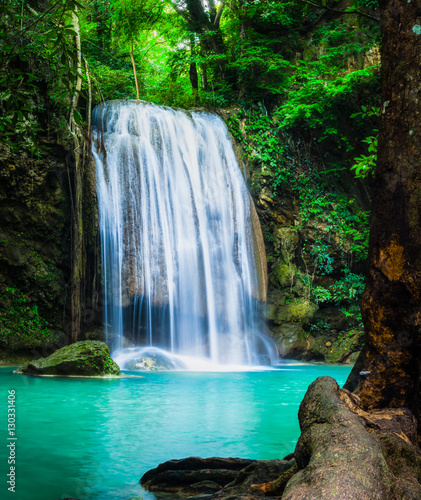 Fototapeta Naklejka Na Ścianę i Meble -  Erawan waterfall, the beautiful waterfall in forest at Erawan National Park - A beautiful waterfall on the River Kwai. Kanchanaburi, Thailand