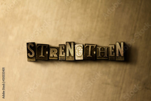 Картината върху платно STRENGTHEN - close-up of grungy vintage typeset word on metal backdrop