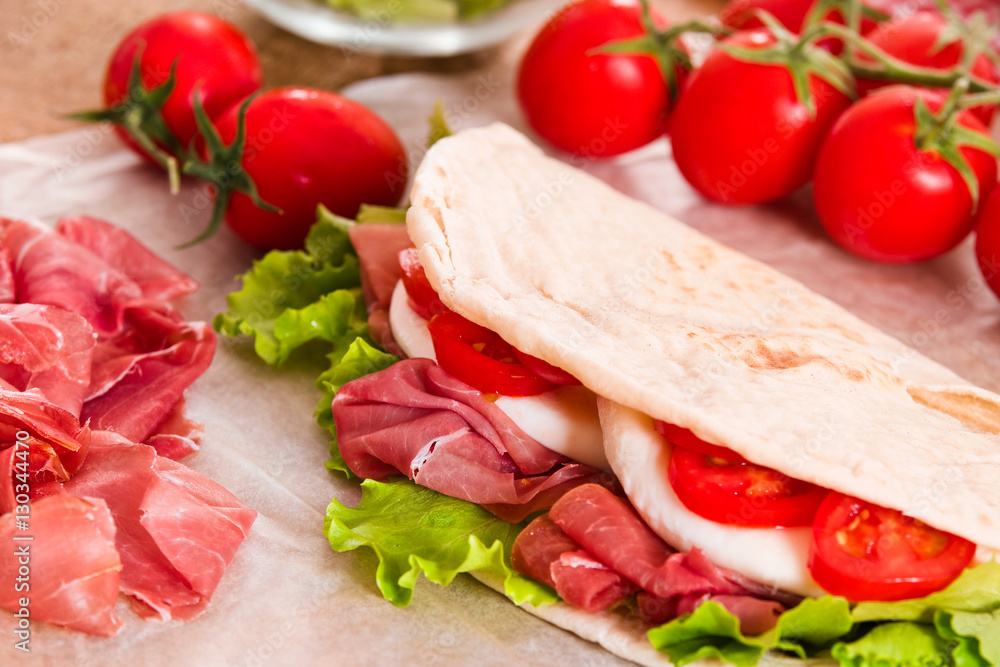 Piadina with ham and lettuce. 