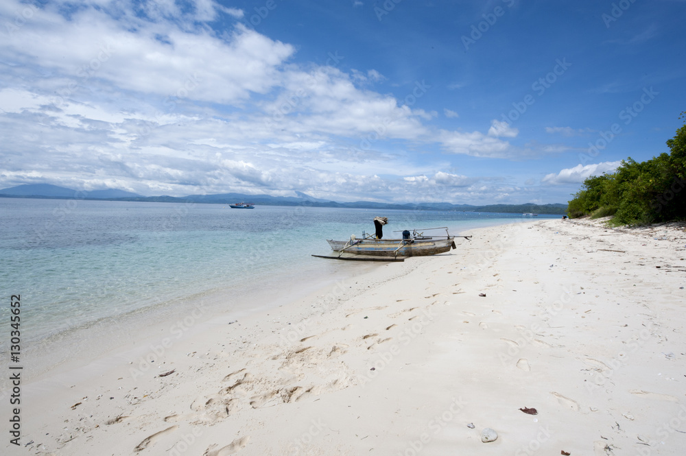 Beach with fishing boat, Manado, Sulawesi, Indonesia Beach with fishing boat, Manado, Sulawesi, Indonesia