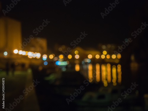 Blurred background of the night city. Abstract blurred bokeh pattern. Blurred background of colourful city lights at night.