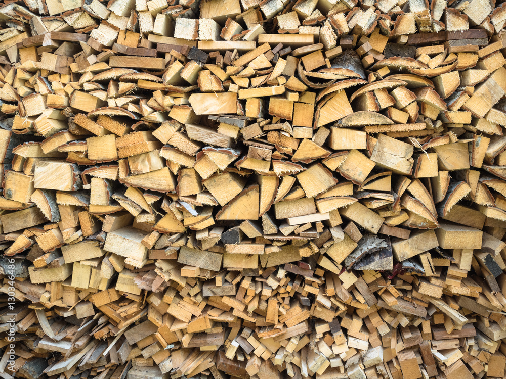 Picture of the firewood stack texture close up. Background of the firewood stack pattern close up. Picture of the firewood stack texture close up. Background of the firewood stack pattern close up.