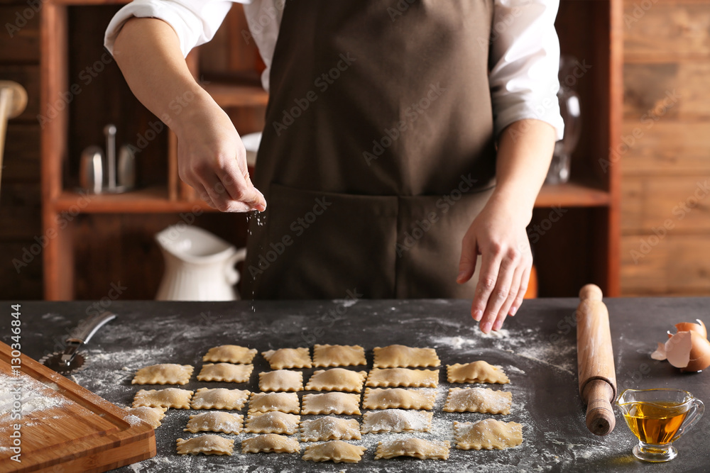 Woman making ravioli on table Woman making ravioli on table