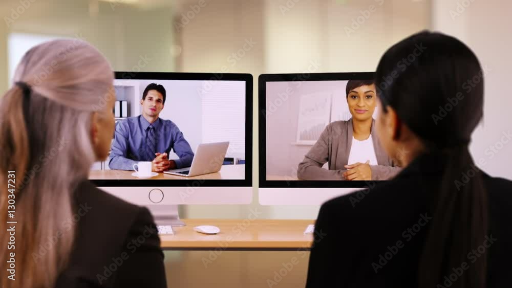 Businesspeople are having a video call to discuss work. A team of businessmen and women converse about work. Businesspeople are having a video call to discuss work. A team of businessmen and women converse about work.