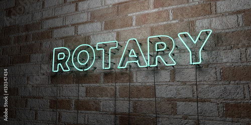 ROTARY - Glowing Neon Sign on stonework wall - 3D rendered royalty free stock illustration.  Can be used for online banner ads and direct mailers..
