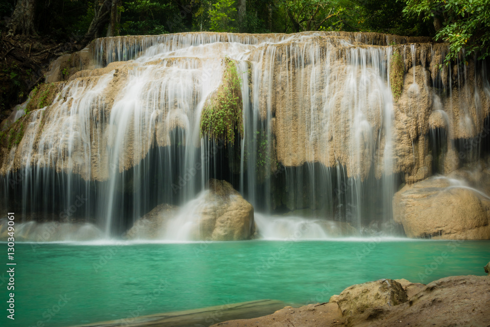 Obraz premium Erawan waterfall, the beautiful waterfall in forest at Erawan National Park - A beautiful waterfall on the River Kwai. Kanchanaburi, Thailand