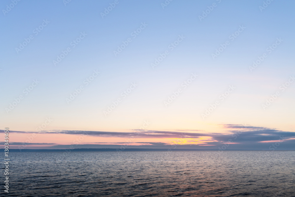 sunrise on the water / Early summer morning bright sky Beach