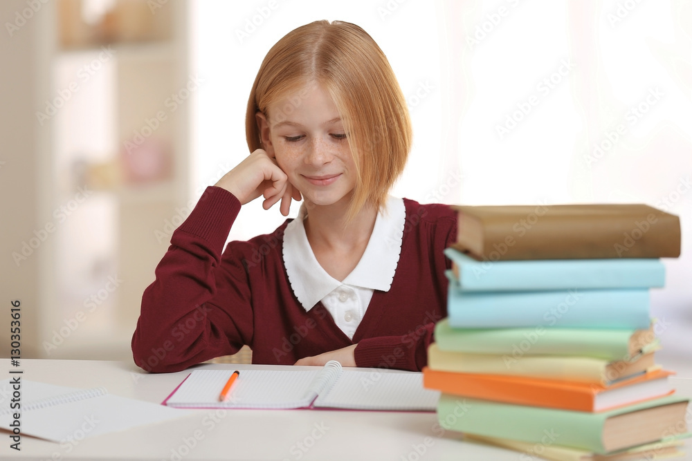 Schoolgirl doing lessons at home Schoolgirl doing lessons at home