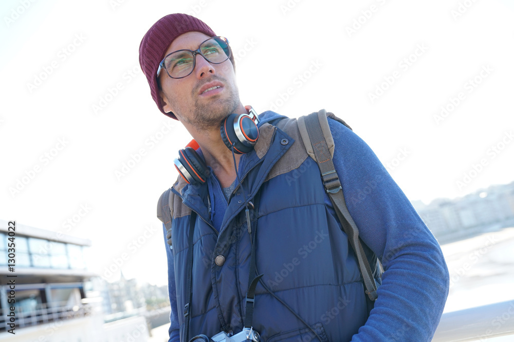 Reporter standing by the beach, looking for picture to take Reporter standing by the beach, looking for picture to take