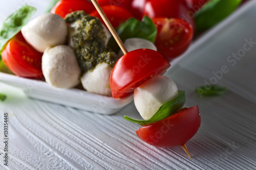  mozzarella with tomato , basil and pesto sauce