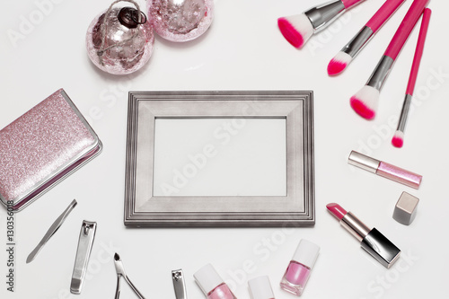 Set is of cosmetics for makeup. Christmas still life has shades of pink. 