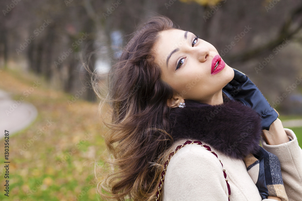 Young beautiful woman in beige coat Young beautiful woman in beige coat