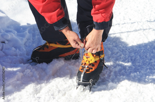 Crampons closeup. Crampons closeup. Crampon on winter boot for c photo