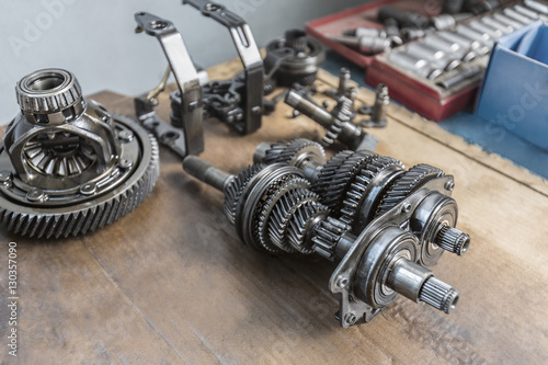 High angle view of machine parts on wooden table
