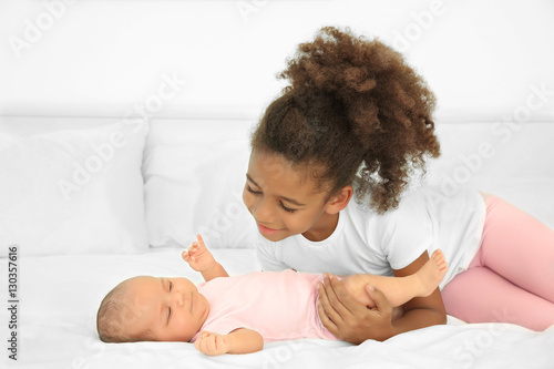 Cute baby and elder sister ...