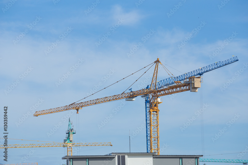 Industrial construction crane with blue sky