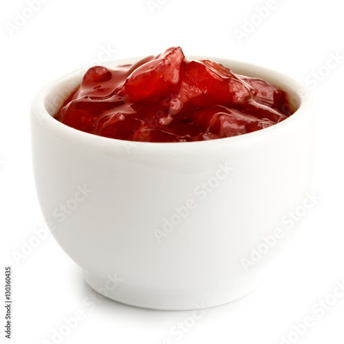 Red onion chutney in ceramic bowl isolated on white.