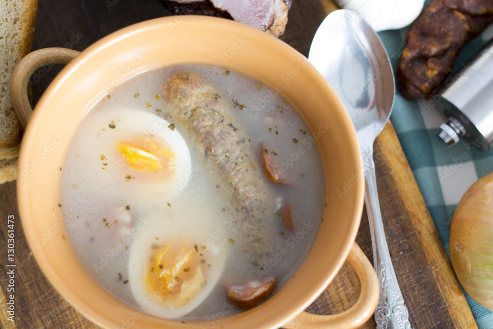 Traditional Zurek with sausage and egg, white borscht, polish Ea Traditional Zurek with sausage and egg, white borscht, polish Ea