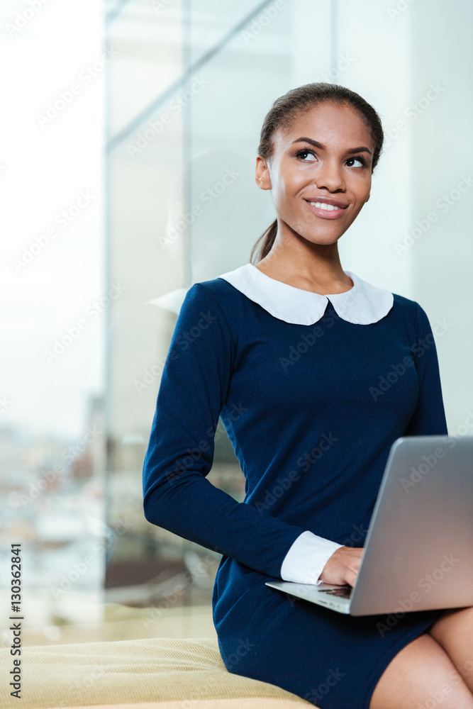 Vertical image of young business woman with laptop Vertical image of young business woman with laptop