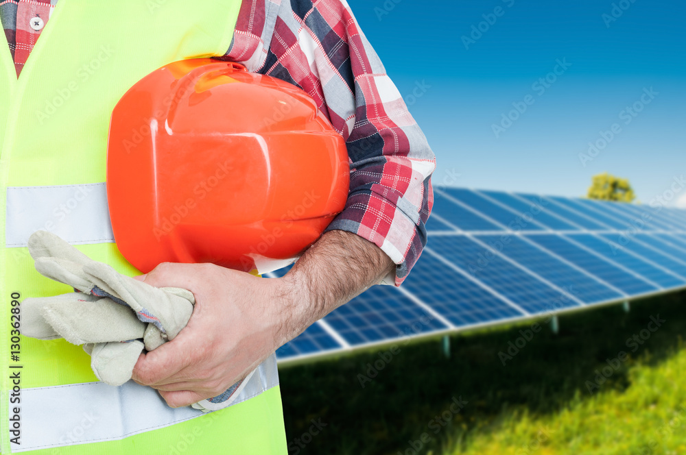 Male worker at photovoltaic panels Male worker at photovoltaic panels