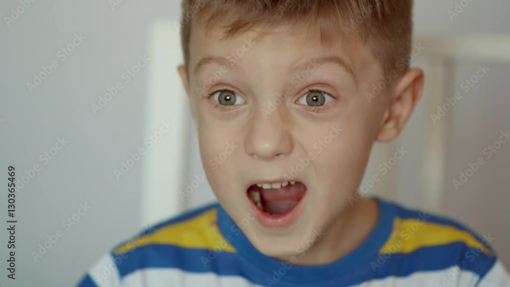 A very cute young surprised boy looking at camera, Isolated on white. A very cute young surprised boy looking at camera, Isolated on white.