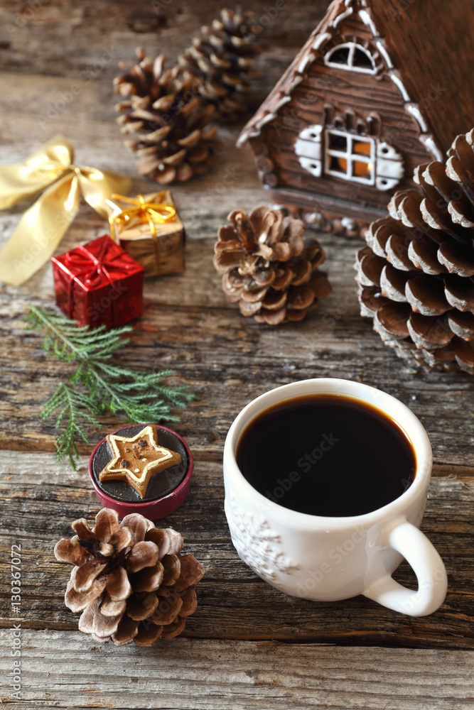 Cup of coffee, pine cones and Christmas-tree decorations Cup of coffee, pine cones and Christmas-tree decorations