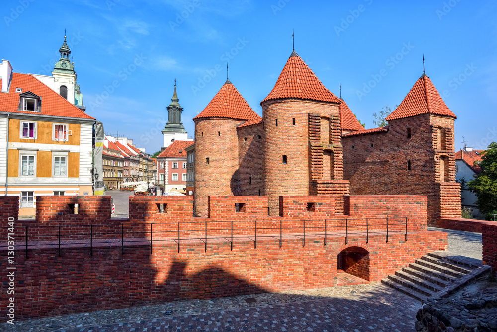 Red brick walls and towers of Warsaw Barbican, Poland