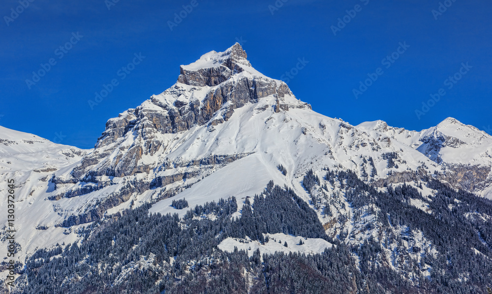Mount Hahnen in the Swiss Alps, wintertime view from the town of Engelberg
