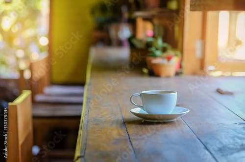 Coffee white mug on wooden table.