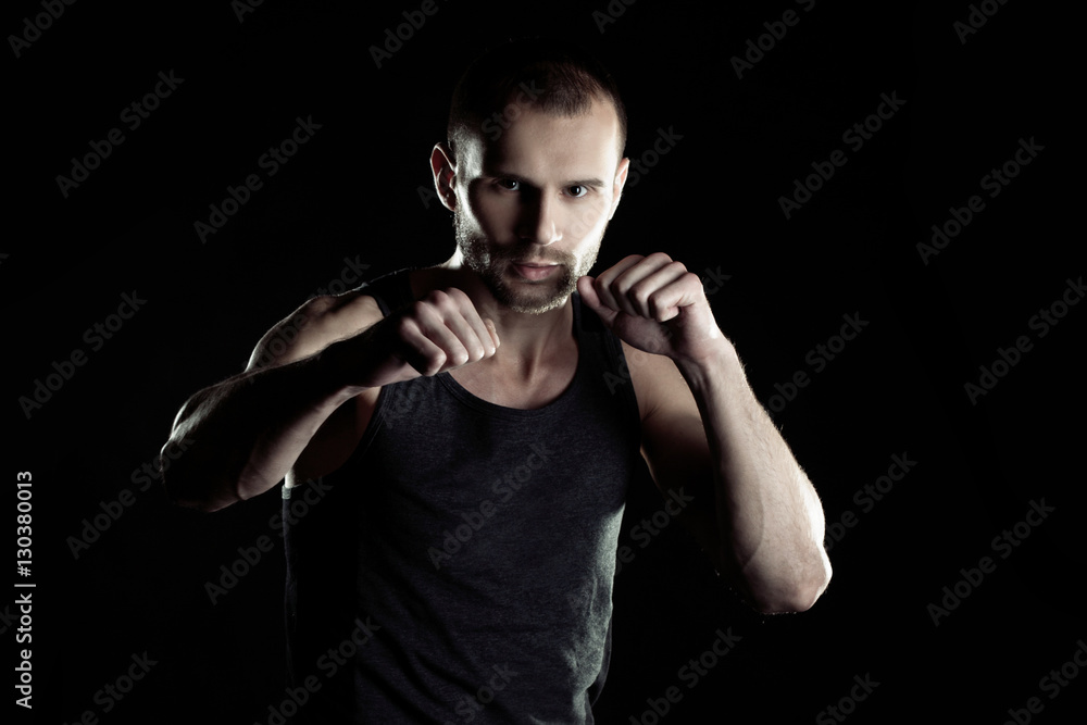 muscular man, hour boxer, black background, horizontally