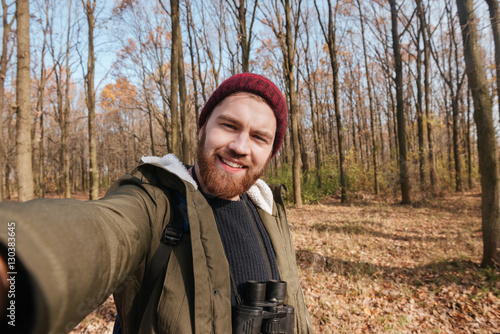 Young bearded man making selfie in the forest. © Drobot Dean