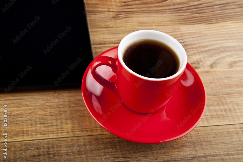 black tablet PC and coffee Cup black tablet PC and coffee Cup