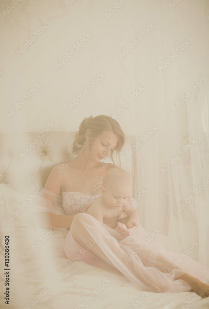 portrait mother playing with her baby portrait mother playing with her baby