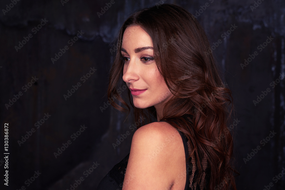 Dazzling female looking away from the camera with perfect make-u Dazzling female looking away from the camera with perfect make-u